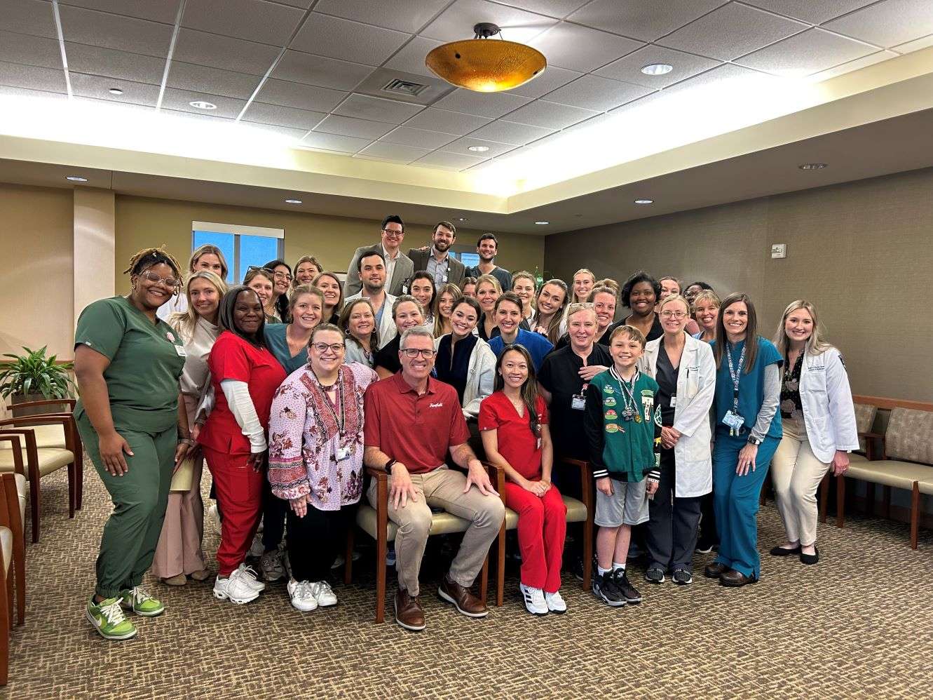 Dermatology faculty, staff, and UMMC medical students take a group photo.